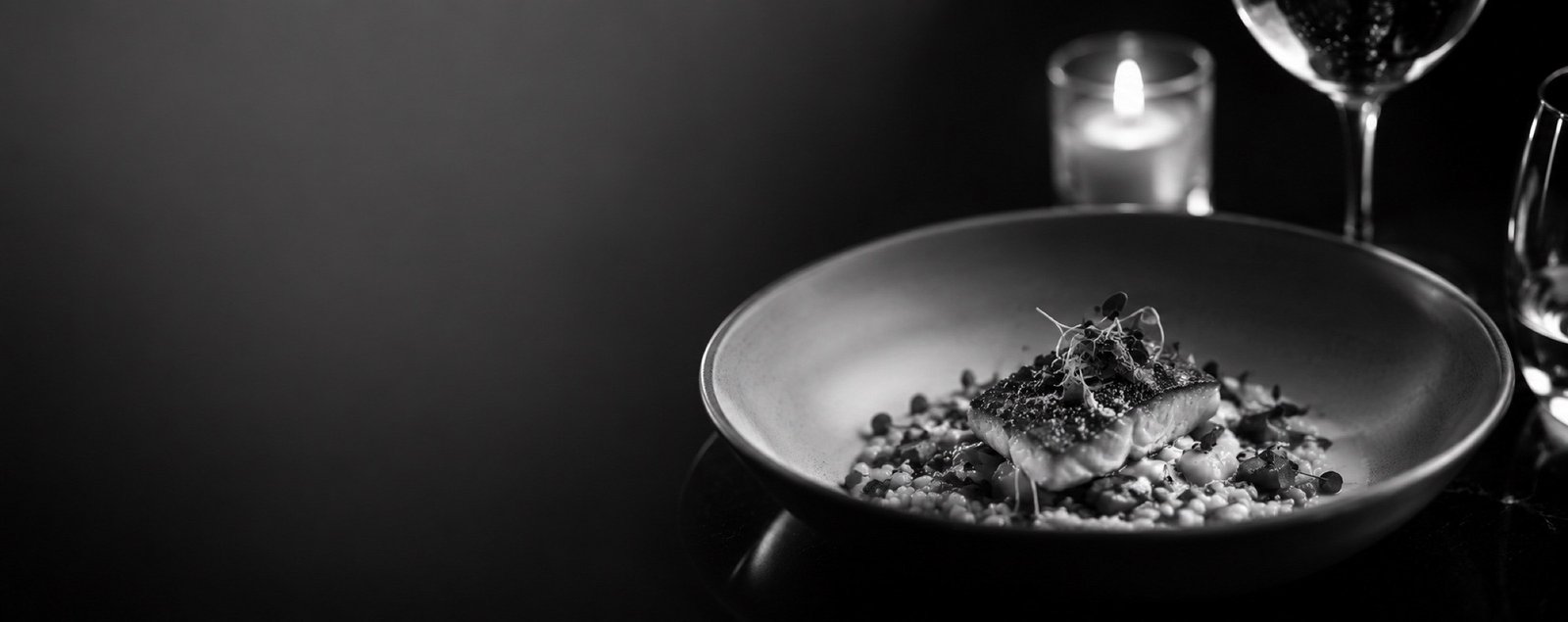 A candlelit plated dish by Virtuoso Catering House